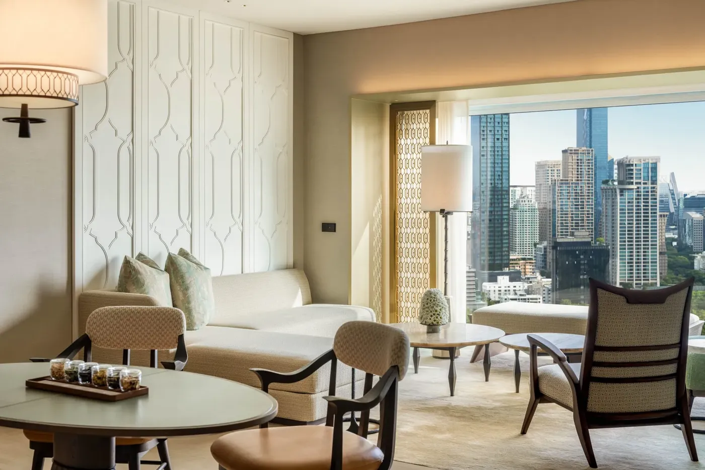 Club Suite living area at Dusit Thani Bangkok with park-view windows over Lumpini Park