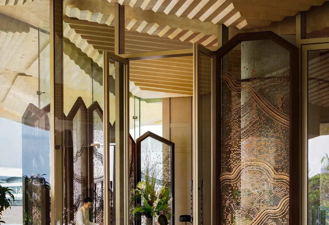 Entrance facade of Dusit Thani Bangkok on Rama IV Road, Silom, with its landmark gold spire
