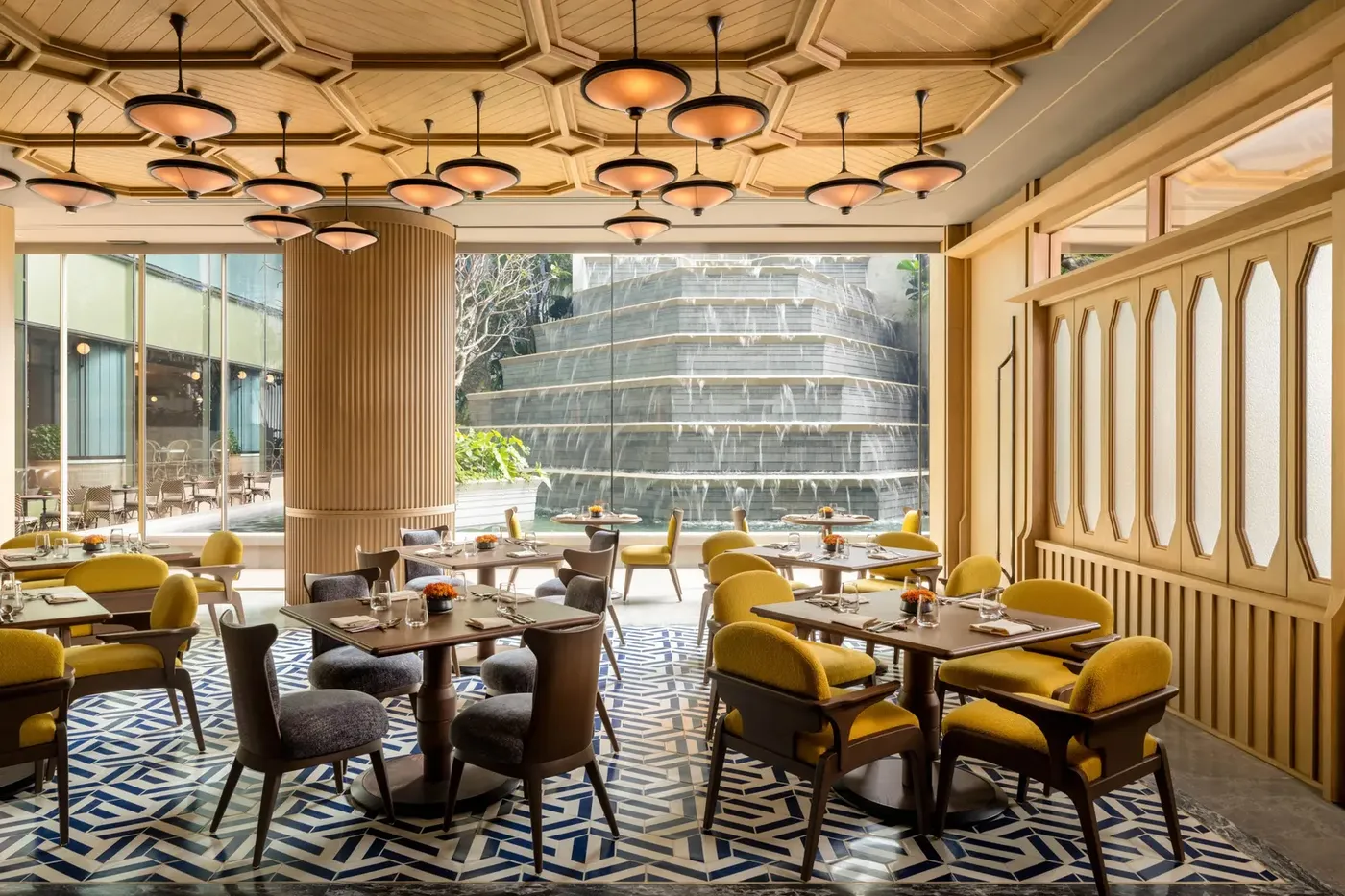 The Pavilion restaurant at Dusit Thani Bangkok beside its interior waterfall wall