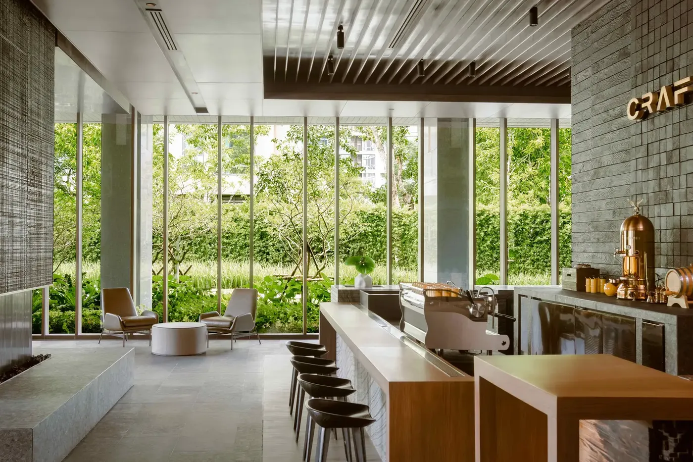 CRAFT restaurant dining room at Kimpton Maa-Lai Bangkok with garden views