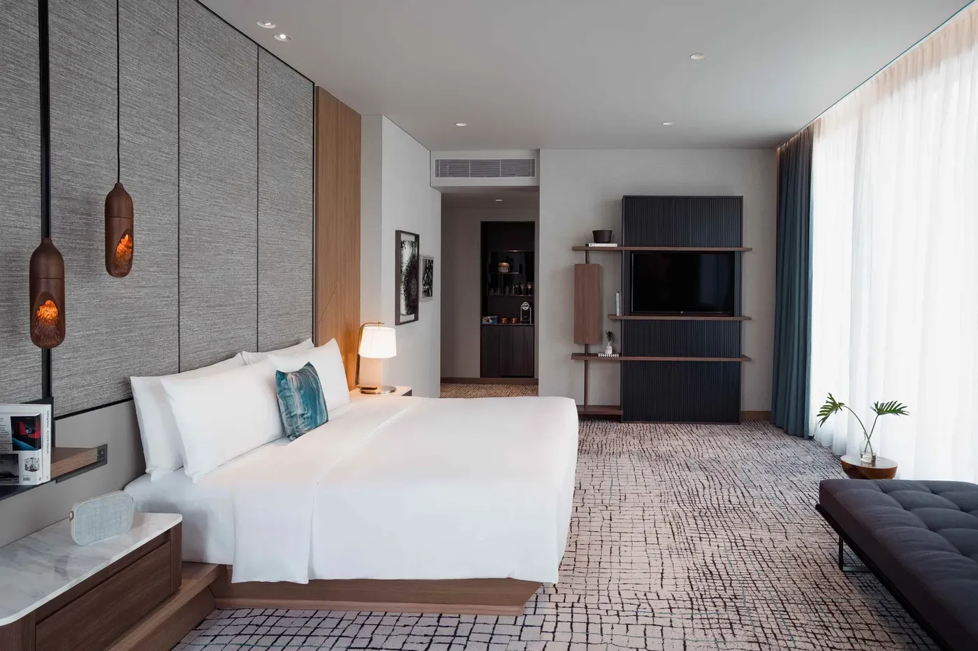 Bedroom of the Maa-Lai Suite with Green Lung View at Kimpton Maa-Lai Bangkok