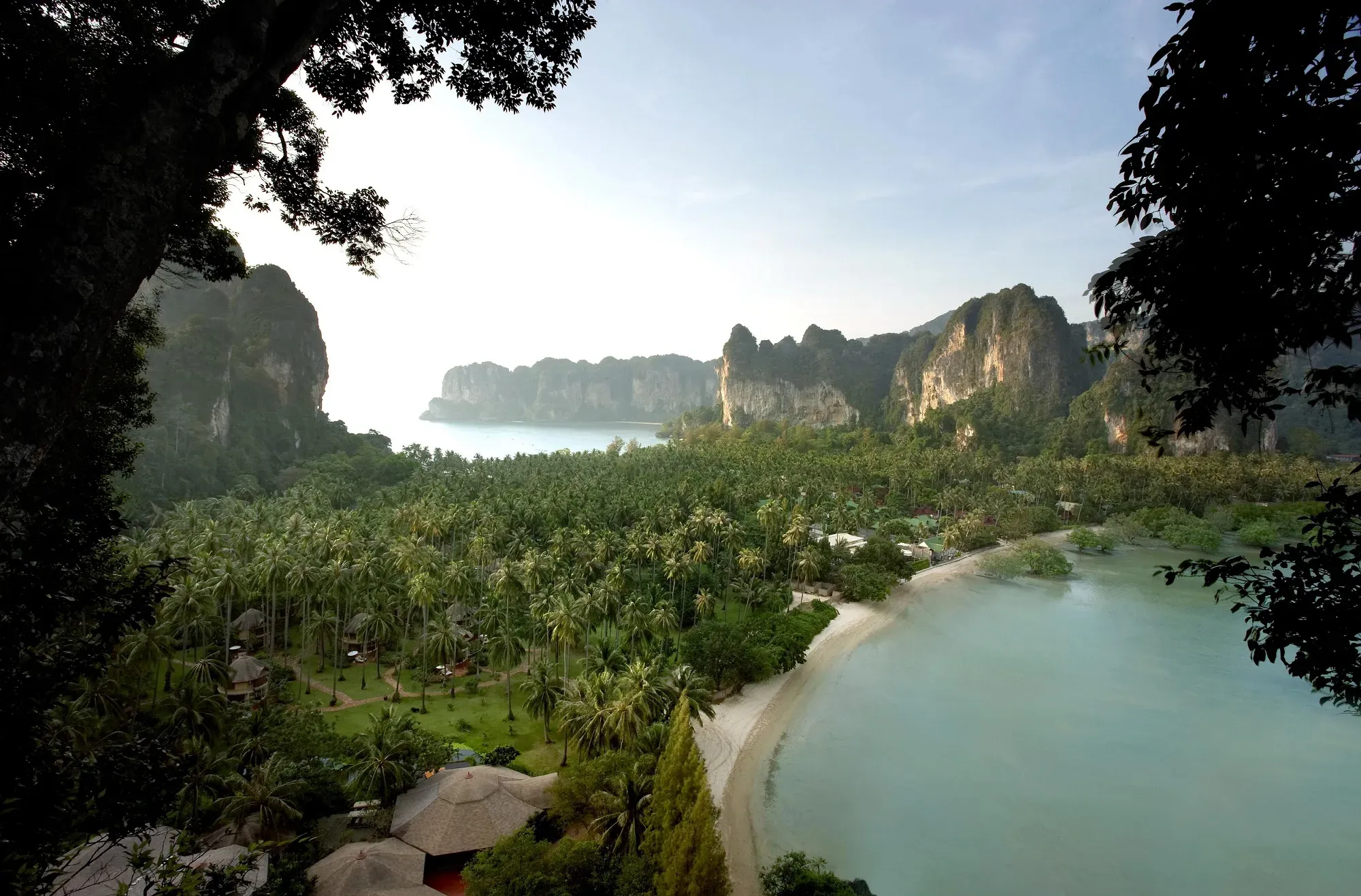 Aerial view of Rayavadee's limestone cliffs and coconut grove on Krabi's Phra Nang peninsula