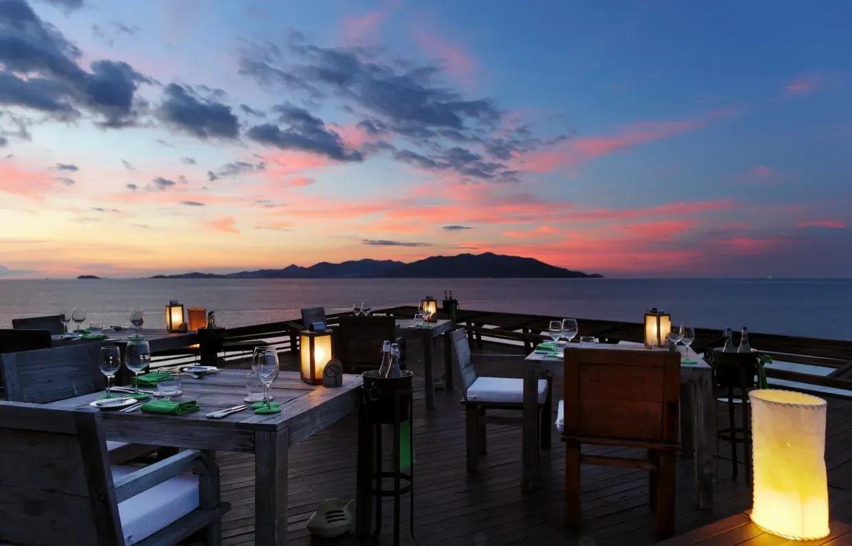 Dining on the Rocks, the cliff-set signature restaurant at Six Senses Koh Samui