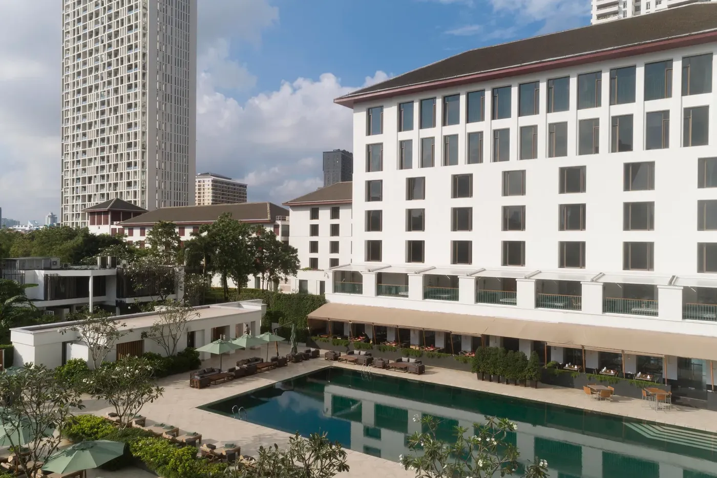 Aerial view of the 25-metre outdoor infinity pool and cabanas at The Sukhothai Bangkok.